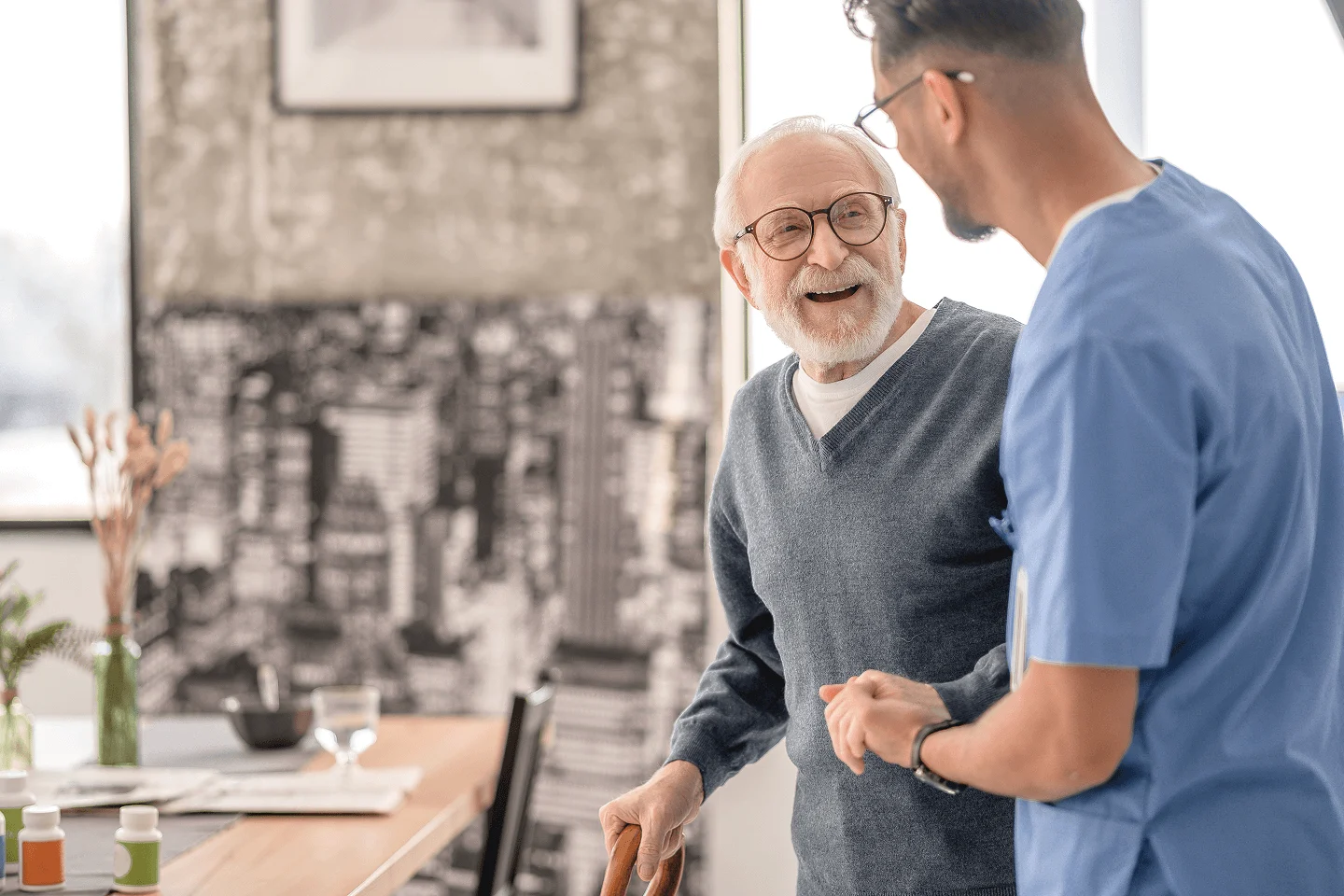 Caregiver and senior smiling together